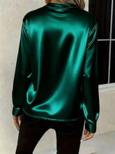 Emerald green satin notched long sleeve blouse with high collar and long sleeves in luxurious satin material