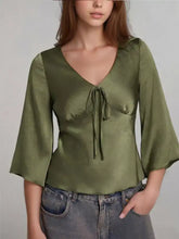 Olive green satin tie-front blouse with v-neck detail for elegant and stylish wear