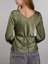 Olive satin satin tie-front blouse long-sleeve top with v-neck and tied waistband for elegant wear