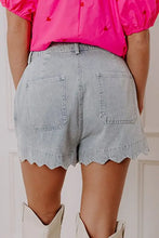 Light wash scalloped hem denim shorts with detailed edges