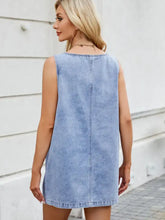 Light blue denim dress with scoop neck wide strap and simple back design shown from the back side