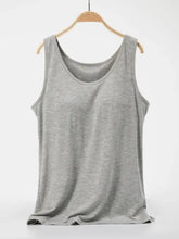 A soft heather gray scoop neck wide strap tank top with a relaxed fit and simple round neckline