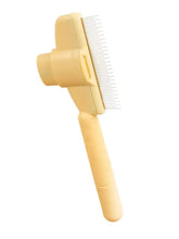Escova amarela auto-limpante para remover pelos de animais, com cerdas metálicas