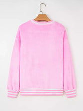 Pink plush sequin chenille merry graphic sweatshirt with white striped slightly stretchy cuffs and hem