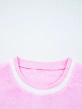 Pink slightly stretchy sequin chenille merry graphic plush sweatshirt with white ribbed collar and fuzzy texture