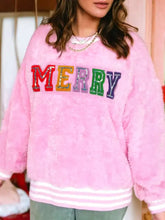 Pink fuzzy sequin chenille merry graphic plush sweatshirt with slightly stretchy fabric and white striped cuffs