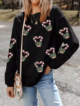Black corduroy sequin christmas candy cane heart graphic sweatshirt with festive green bow patches and care instructions