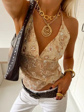 Beige embroidered halter neck cami with floral paisley patterns and delicate sequin embellishments