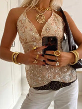 Beige floral sequined halter neck cami with gold metallic embroidery and deep v-neckline for elegant wear