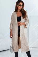 Beige sequined duster coat with high-low hem, open front, varying sleeve lengths