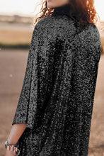 Black sequined cape with high collar and three-quarter sleeve length