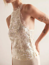 Ivory sequin halter neck cami with delicate lace trim featuring shimmering fabric for elegant evening wear