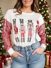 Sequin nutcracker round neck long sleeve sweatshirt with pink sequin sleeves