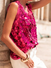 A vibrant fuchsia sequin round neck tank with circular shimmering embellishments in a sleeveless design