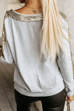 Women’s gray long-sleeved Sequin V-Neck Sweatshirt with gold accents