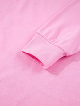 Pink sequin xoxo letter graphic baggy sweatshirt with slightly stretchy fabric and ribbed cuffs with care instructions