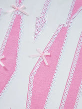 Pink fabric strips with white lace trim and small pink bows on a slightly stretchy sequin xoxo letter graphic baggy sweatshirt