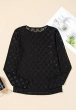 Sheer black mesh long-sleeve top with bow pattern