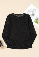 Sheer black mesh long-sleeve top with bow pattern