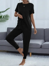 Black shiny round neck short sleeve top and matching jogger pants set with comfortable sleeve length for loungewear