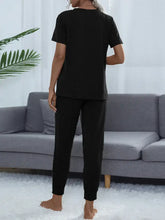 Black shiny round neck short sleeve top and jogger pants set with short sleeve length for comfortable loungewear