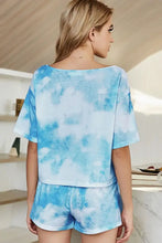 Blue and white tie-dye two-piece loungewear set with boat neck and short sleeve length top and matching shorts