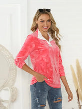Women’s shiny tie-dye half button long sleeve T-shirt in pink with white collar and jeans