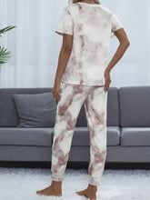 A cozy white and muted rose tie-dye pajama set with a round neck and short sleeve length top and soft relaxed pants