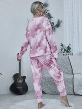 Pink shiny tie-dye round neck top and drawstring pants lounge set made of soft fabric for comfortable wear