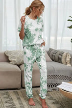 A soft white and mint green tie-dye tee and drawstring waist joggers lounge set with a relaxed fit