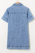 Blue denim short sleeve collared shirt with stitched details featured in a denim mini dress design