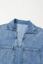 Blue denim mini dress with collar short sleeves and two front patched pockets in denim material