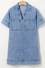 Light blue denim mini dress with short sleeves collar and two front patched pockets in denim fabric