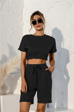Black short sleeve cropped top with elastic waistband made of soft fabric for comfortable lounge wear