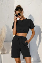 Black short sleeve cropped top and drawstring shorts lounge set with elastic waistband in comfortable fabric