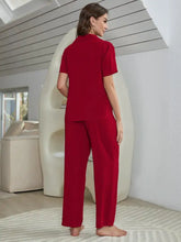 Red short sleeve shirt bralette and pants lounge set featuring a collared top with short sleeve length and straight-leg pants