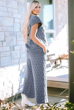 Gray quilted short sleeve top and pocketed pants lounge set with geometric triangle pattern and stylish sleeve length