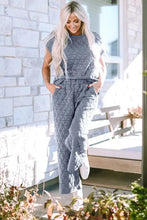 Gray quilted short sleeve top and pocketed pants lounge set with high neckline and tapered legs featuring sleeve length detail