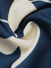 Navy blue and cream silk scarf with abstract waves on Short Sleeve Top and Skirt Set