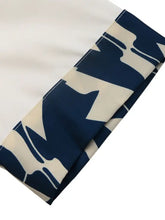 Short sleeve top and skirt set with navy blue cream abstract leaf sleeve pattern