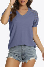Periwinkle short sleeve V-neck tee with raglan sleeves and denim shorts