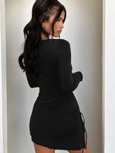Charcoal gray ruched bodycon dress with lace-up sides and long sleeves