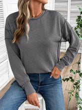 Gray ribbed knit side slit round neck sweatshirt with thin white stripes, slightly stretchy, machine wash cold care instructions