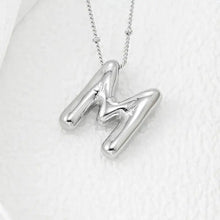 Shiny silver-toned M letter pendant necklace with delicate chain