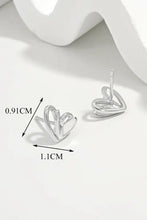 Sterling silver heart stud earrings with polished modern design