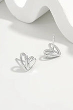 Sterling silver heart stud earrings in silver-toned heart shape