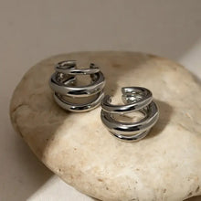Silver layered cuff earrings with modern spiral hoops
