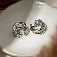Two shiny silver layered cuff earrings spiral multi-band set