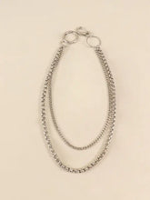 Silver-tone metal chain belt with layered chains, O-rings and carabiner clip