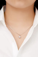 Delicate silver necklace with 1 carat moissanite pendant in six prong setting